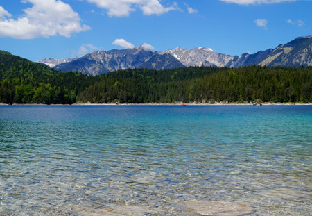 Picturesque turquoise lake Eibsee by the foot of mountain Zugspitze in Bavaria (Garmisch, Germany