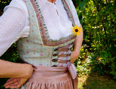 A closeup shot of a woman wearing a traditional bavarian dirndlの写真素材
