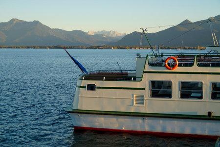 Passenger boat on Lake Geneva in Switzerland with mountains in the backgroundの写真素材