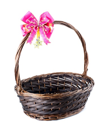 Empty wicker basket with red bow isolated on white background の写真素材