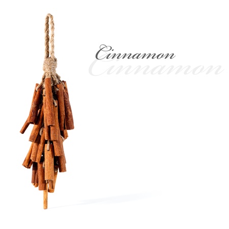 Dried cinnamon tied up and hanging, isolated with copy space の写真素材