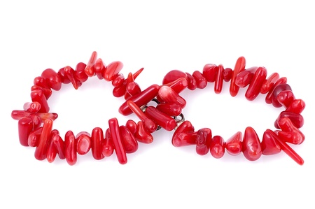 Natural coral bracelet laid out as infinity symbol, isolated on white background の写真素材