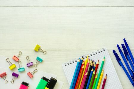 Layout of school supplies on a white wooden background.の写真素材