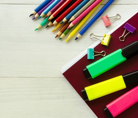 Layout of school supplies on a white wooden background.の写真素材