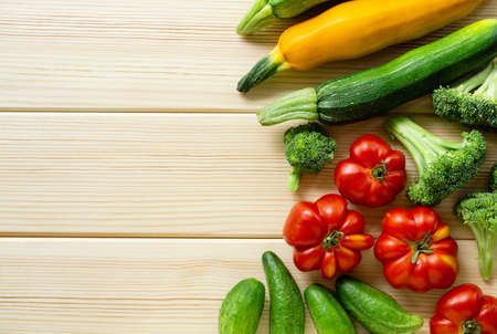 Set of various vegetables on a light wooden background. Space for textの写真素材