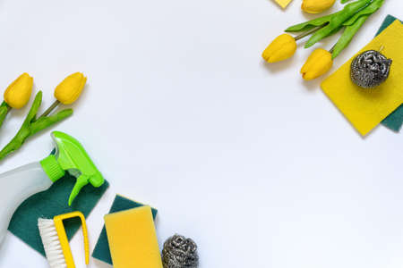 Spring flat lay of cleaning supplies and items on white background, space for textの写真素材