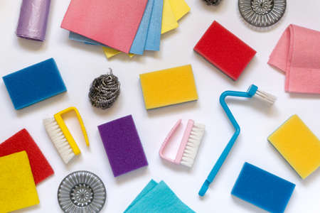 Flat lay of various items for cleaning and household on white background, top viewの写真素材