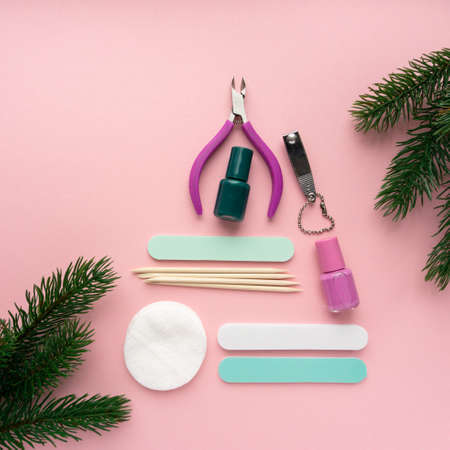 Christmas tree made of manicure and pedicure items on pink background, top viewの写真素材