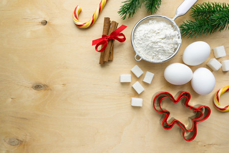Ingredients for baking christmas gingerbread cookies. Flour, eggs and sugar on wooden background, copyspaceの写真素材