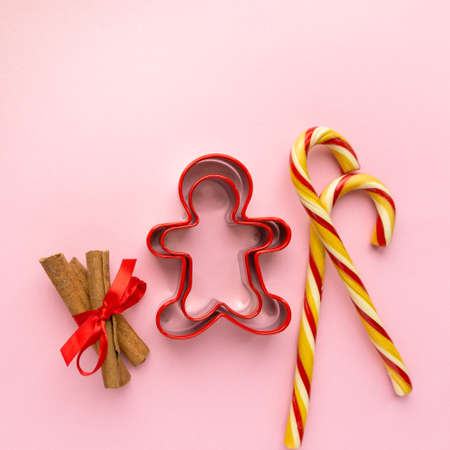 Christmas cookie cutters in the shape of man on pink background, top viewの写真素材