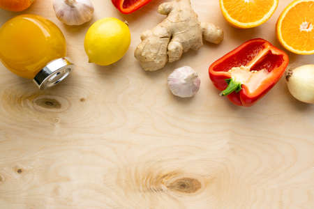 Various products for immunity boosting. Vegetable, fruit and honey on wooden background, copyspaceの写真素材