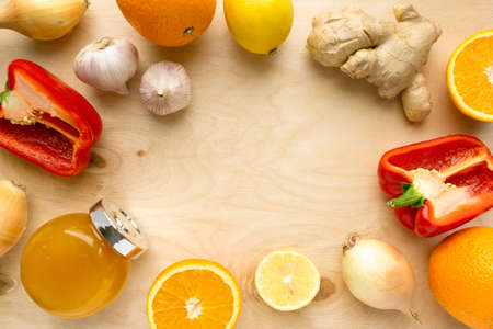 Various products for immunity boosting. Vegetable, fruit and honey on wooden background, copyspaceの写真素材