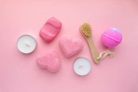 Valentines day flat lay. Bath bombs, soap and candles on pink background, top viewの写真素材
