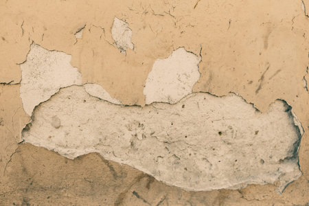 Old painted cracked wall. Grunge background, close up aged texture.の写真素材
