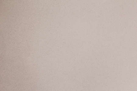 An aged paper, close up top view. Horizontal paper background with vintage texture in coral pink palette.の写真素材