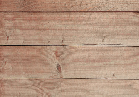 A hardwood aged wall. A background with wooden brown planks. Natural tree texture.の写真素材