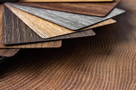 Sample of wood laminated chipboard for furniture design on wooden background with copy space.の写真素材