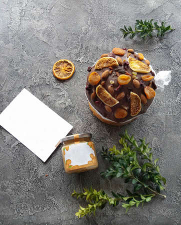 Easter cake. Concrete background. Easter decorated with dried fruits and nutsの写真素材