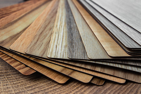 Sample of wood laminated chipboard for furniture design on wooden background with copy space. Color...