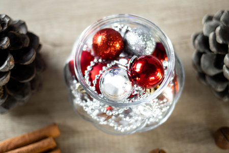 Christmas decorations, gift boxes and Christmas elves under the Christmas tree in the dark in the twinkling of the garland. New year time.の写真素材