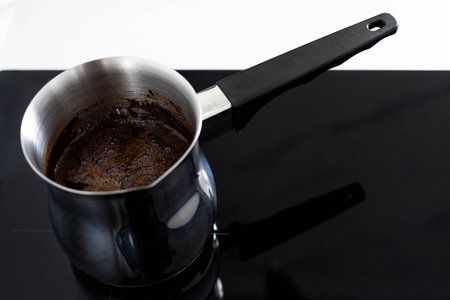 Aromatic coffee boils in the turk and foams to the brim. A drink for your morning breakfast or...
