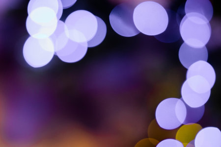Abstract multicolored bokeh on a dark background. Beautiful background with colorful bokeh on a black background.の写真素材