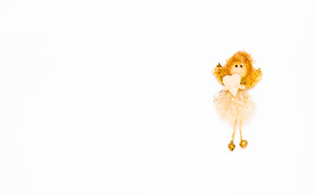 The angel is isolated on the white background with copy space. The atmosphere of Christmas and New Year. Christmas banner, mock-up.の写真素材