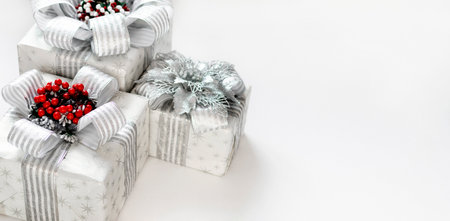 Gift boxes are isolated on a white background with copy space. The atmosphere of Christmas and New Year. Christmas banner, mock-up.の写真素材