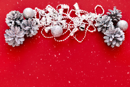 Christmas decorations on a red background with with copy space. The atmosphere of Christmas and New Year. Christmas banner, mock-up.の写真素材