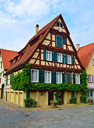 Old typical German house (Fachwerkhaus) in Tuebingen, Germanyの写真素材