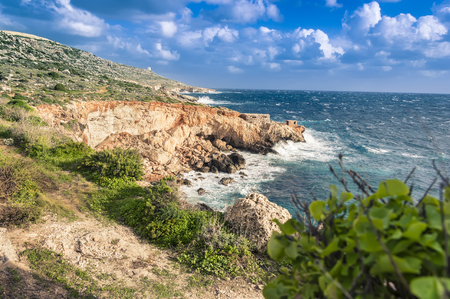 Ghar Lapsi Bay, Malta. Scenic coastline with rocky swimming cove and turquoise waterの写真素材