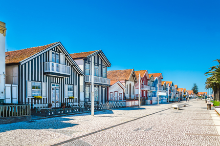 Costa Nova, Portugal: colorful striped houses called Palheiros with red, blue and green stripes. Costa Nova do Prado is a beach village resort on Atlantic coast near Aveiro.の写真素材
