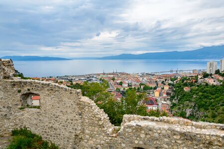 Rijeka, Croatia: panoramic view from Trsat castle over the town and marine. Hilly landscape on a sunny dayの写真素材