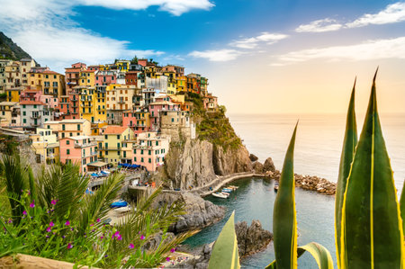 Manarola, Cinque Terre - romantic small village with colorful buildings on cliff overlooking sea....
