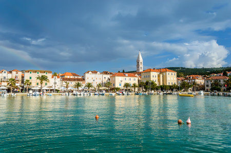 Supetar on Brac Island near Split, Croatia. Small seaside town with promenade and harbor with boats,...