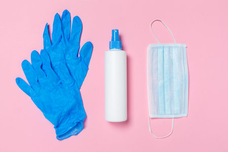 Coronavirus protection. Medical surgical mask, disinfectant or hand sanitizer and blue disposable...