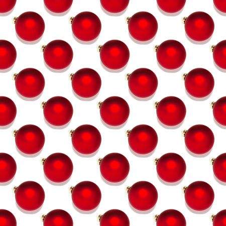 Seamless pattern with red Christmas baubles on white background. Repetitive Christmas ball ornaments...
