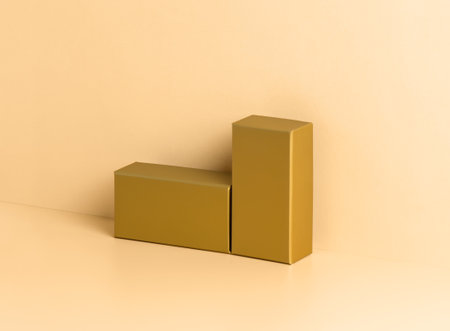 Golden podium for product presentation on neutral beige background. Two block stands of different height. Trendy design or mock up for package placement, promotion sale and cosmetic displayの写真素材