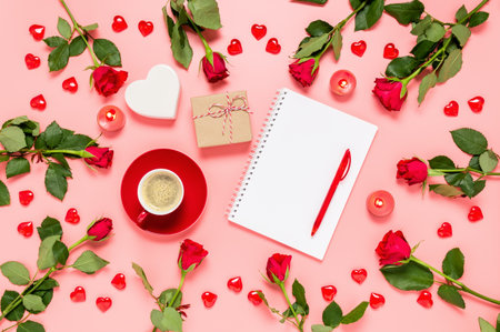 Writing prompts for Valentine's day. Flat lay with red roses, coffee cup, present, hearts and blank notebook on pink background. Be my Valentine. Love and dating concept. Copy space for textの写真素材