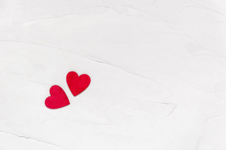 Two red wooden hearts on textured concrete background from above. Love and togetherness concept. Valentines Day. Flat lay with copy space for your textの写真素材