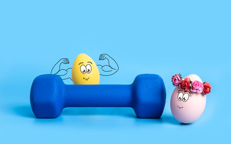 Couple of funny Easter eggs with cute faces. Strong yellow boy shows his muscles behind dumbbell,...