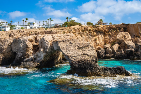Love bridge near Ayia Napa in Cyprus, view from water. Natural rock arch formation Bridge of Lovers at Cape Greco. Sea caves on coastline between Agia Napa and Cavo Greco National parkの写真素材