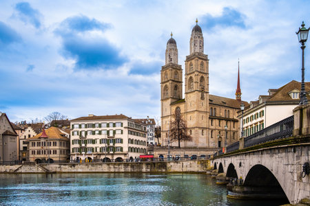 Panoramic view of Zurich city center, Switzerland. Zuerich old town with famous Fraumunster and Munsterbrucke bridge on bank of river Limmat in winterの写真素材
