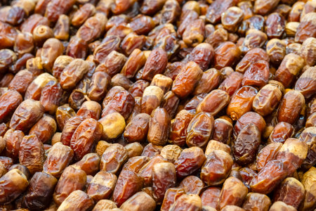 Dried dates at souk in Morocco. Pile of dates fruit at market stall filling all frame. Organic dried...