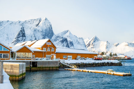 Sakrisoy fishing village and snowy mountains in winter on Lofoten islands, Norway. Winter landscape...