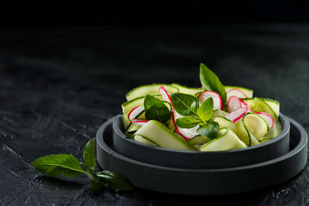 cucumber and radish salad on a plate. high quality photoの写真素材