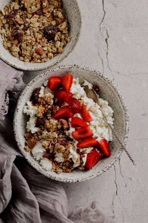 cottage cheese with strawberries and granolaの写真素材