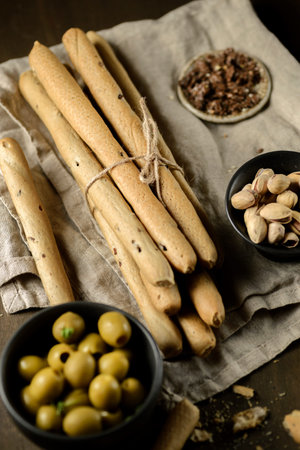 grissini pistachios and olives appetizers for wine. high quality photo