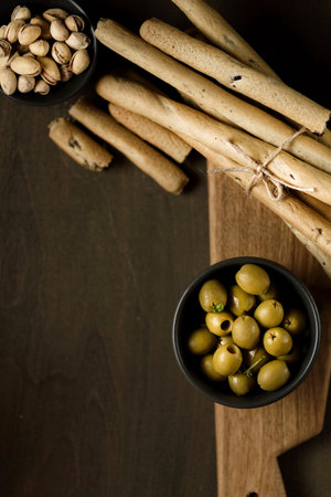 grissini pistachios and olives appetizers for wine. high quality photo