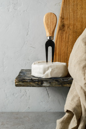 brie cheese and a cheese knife. high quality photoの写真素材